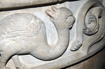 Closeup of a creature carved on the bowl of the font in Studham church November 2009